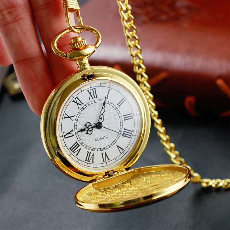 Gold pocket watch and chain